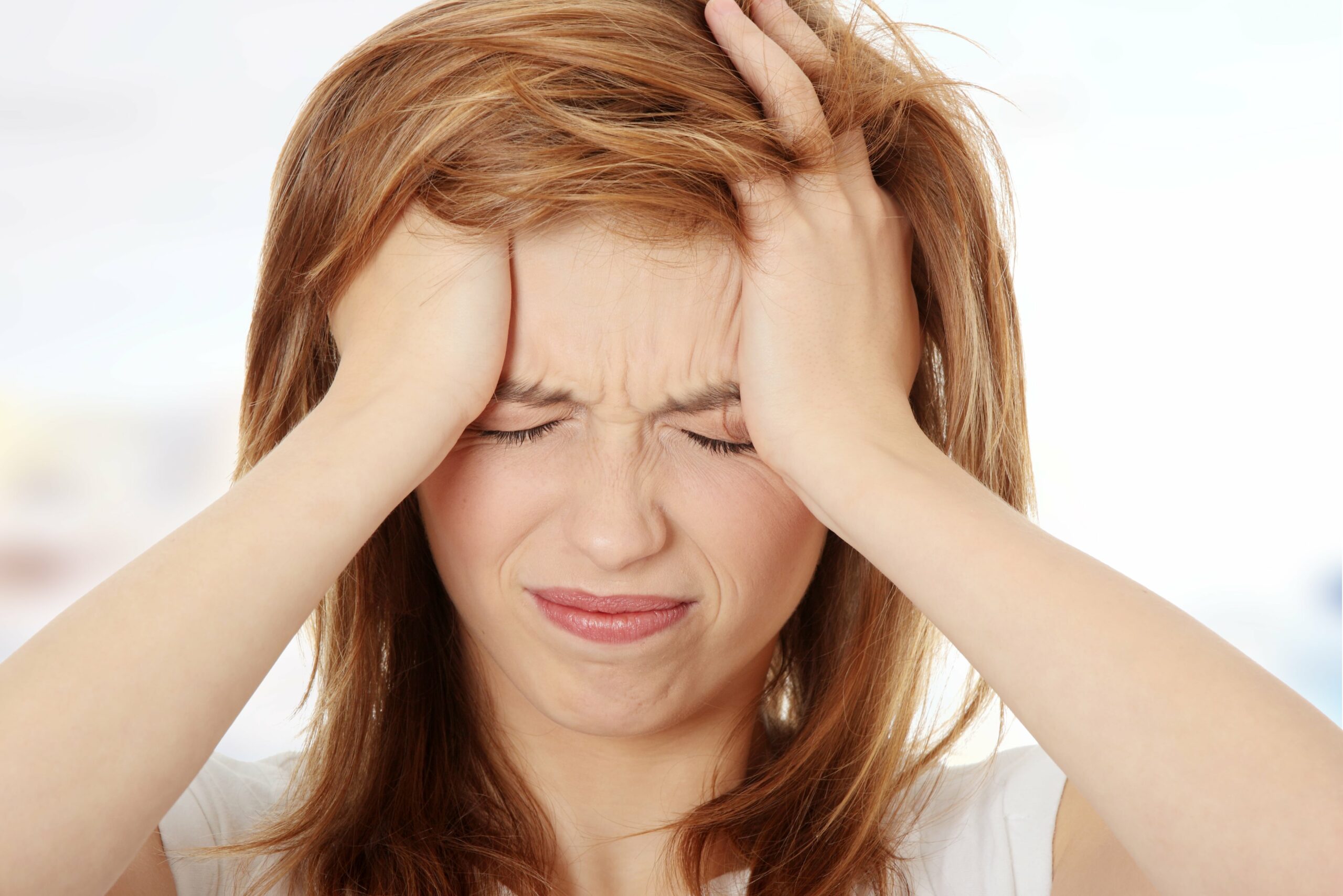 Woman dealing with a migraine