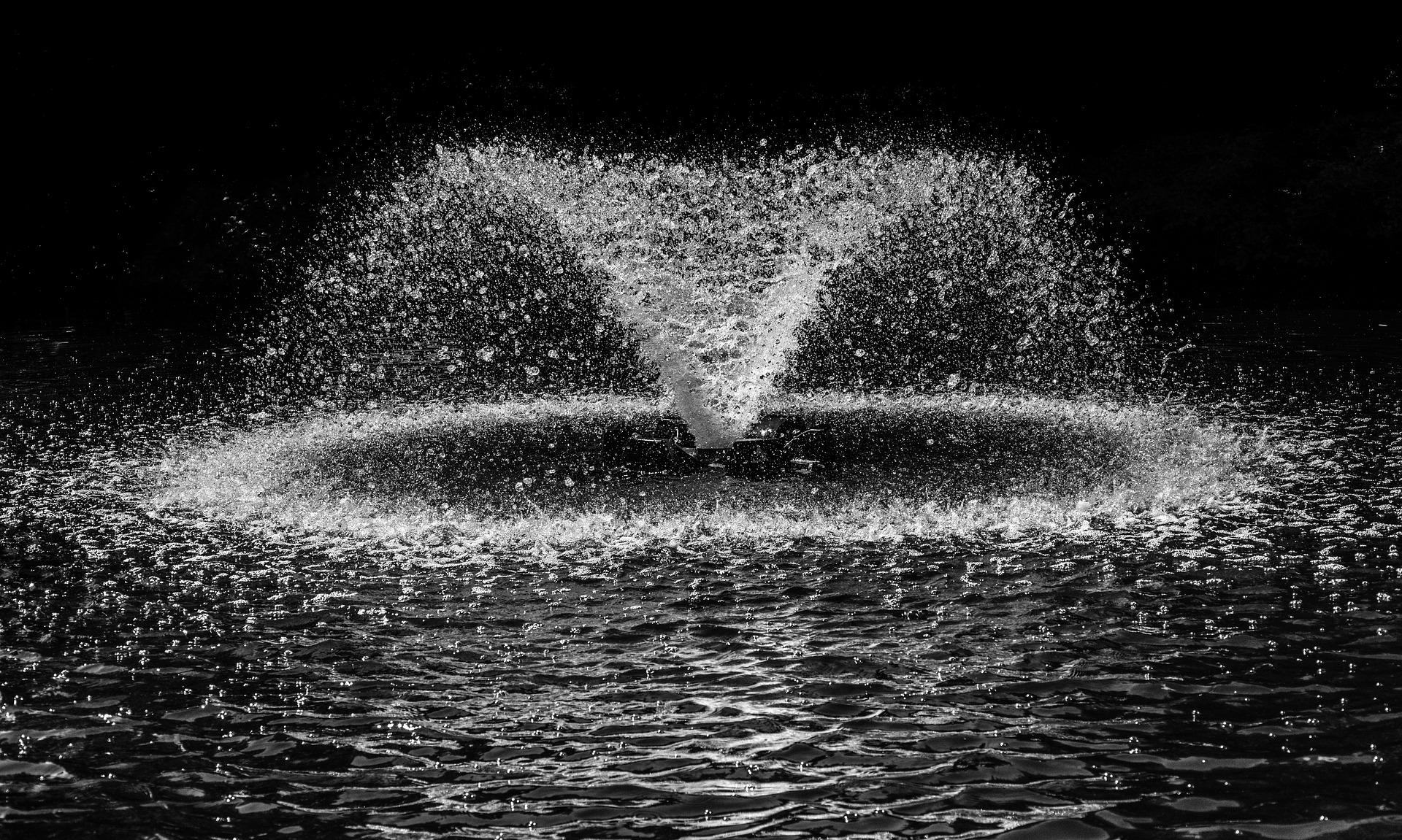 A water fountain spraying in a lake