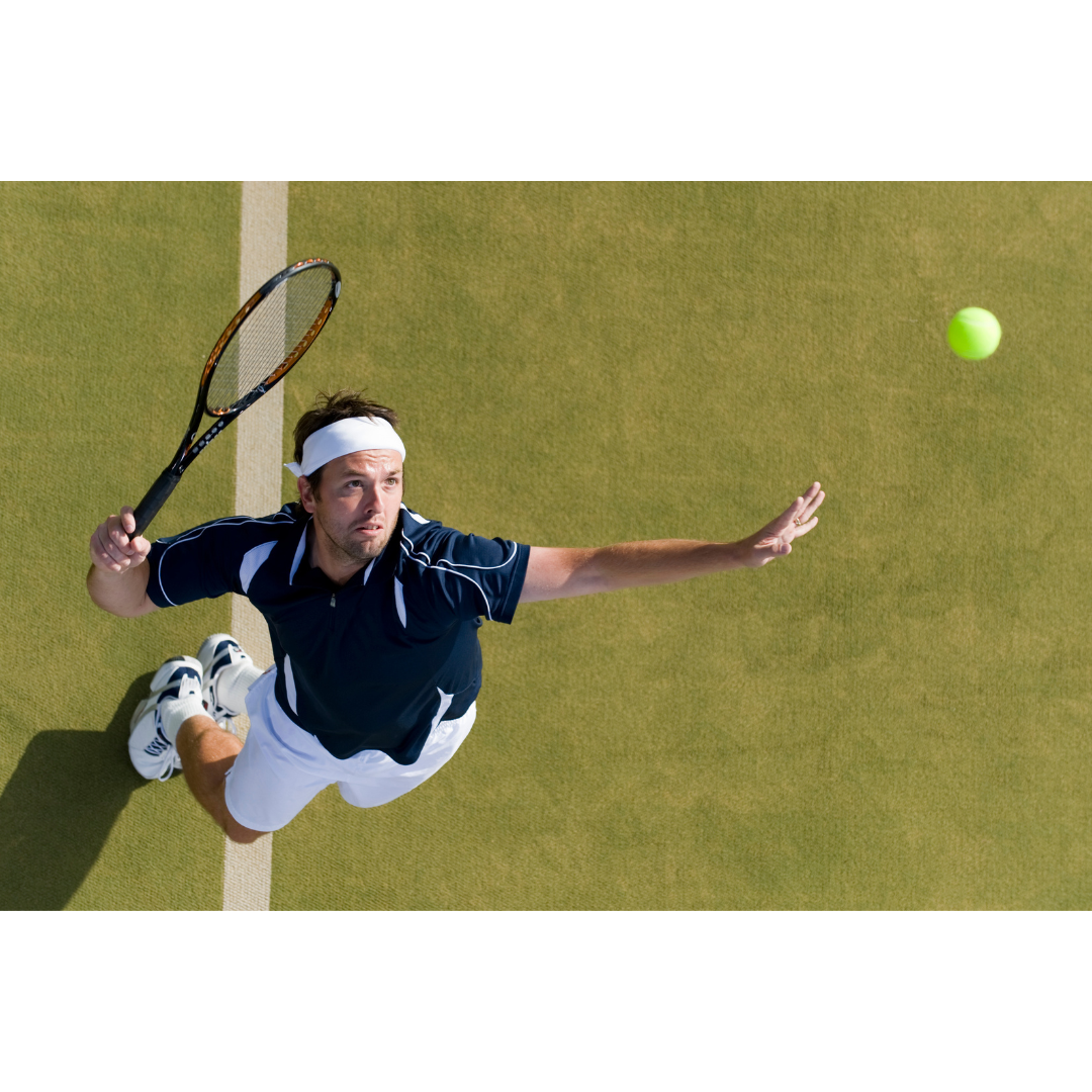 a tennis player serving the ball, about to strike it