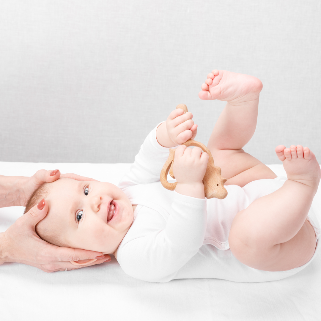 chiropractor performing chiropractic therapy on a baby - a paediatric patient