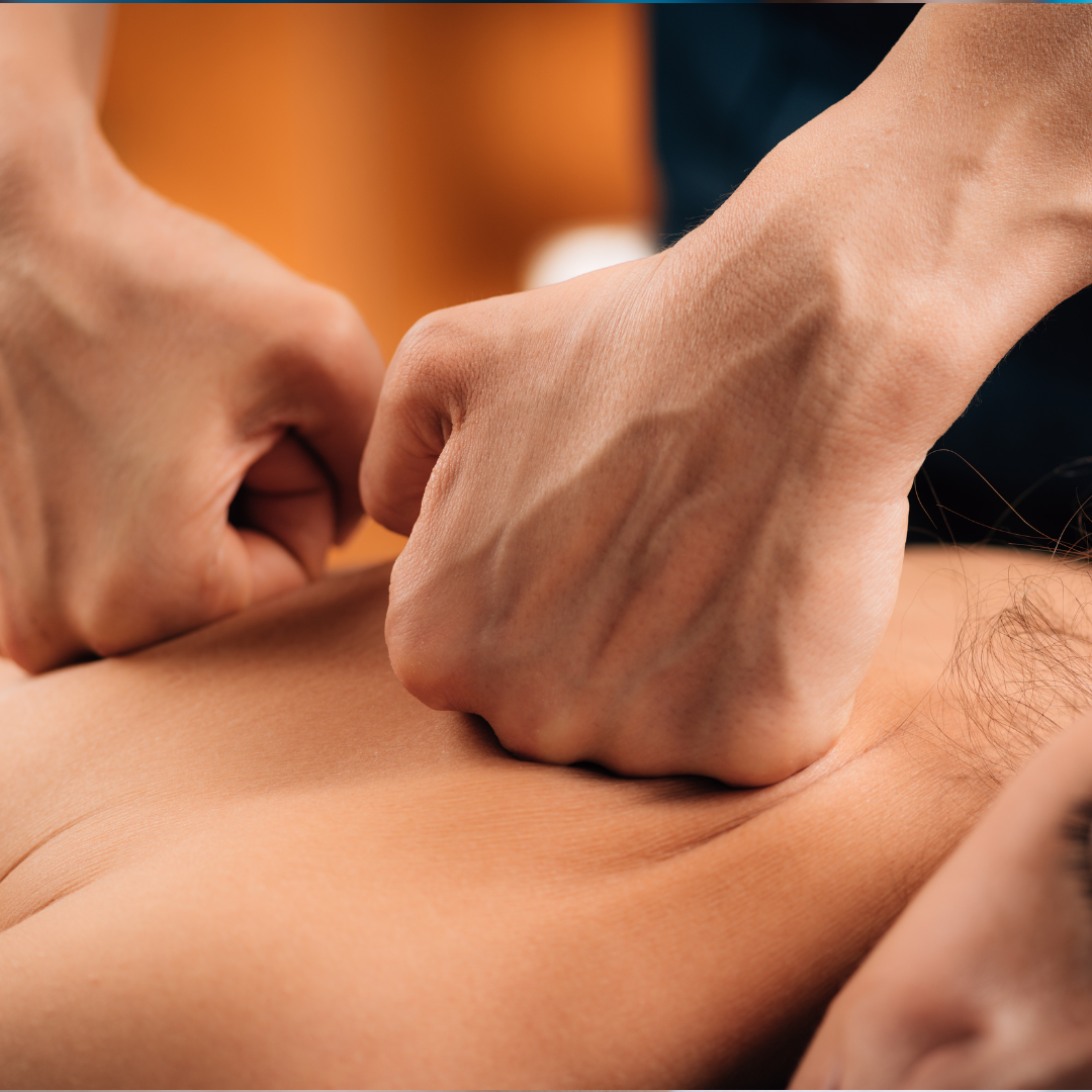 man having deep tissue therapeutic massage done on his upper back