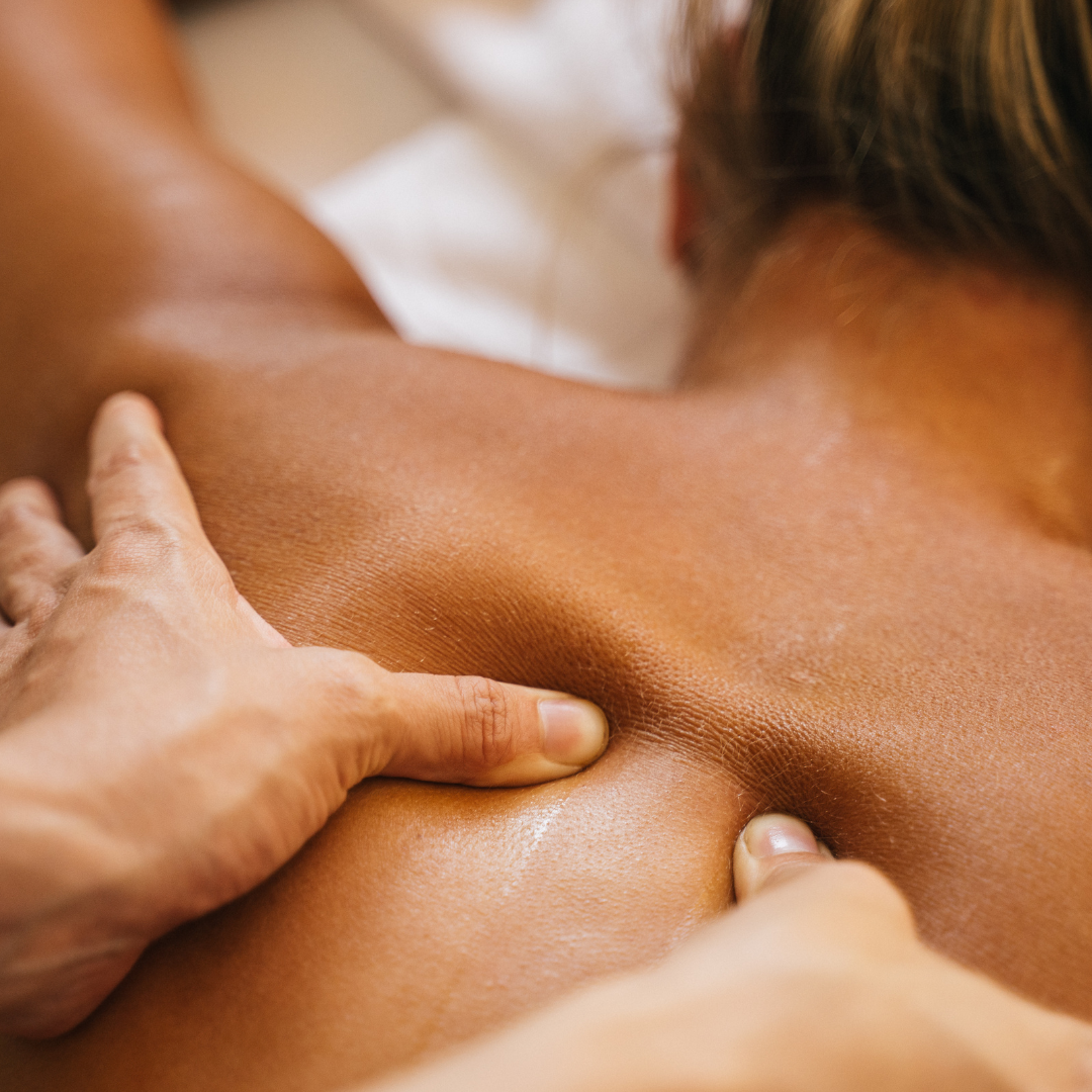 woman getting Rapid Neruofascial Reset massage therapy performed on her back