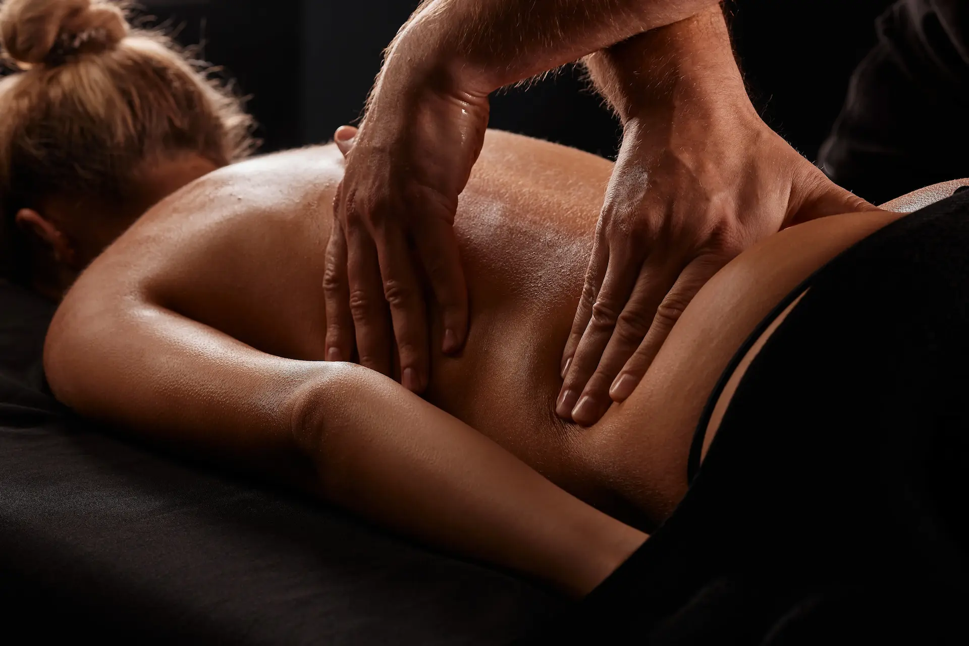 woman getting a massage by a massage therapist